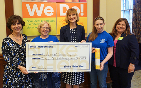 Burke & Herbert Bank representatives present a $2,600 check for the 2018 Coin Drive to SCAN of Northern Virginia representatives at the Bank's historic Main Office. From left to right are: B&HB Vice President Jane Petty, SCAN Director of Development Sally Richards, B&HB Executive VP Terry Cole, Samantha Hagenow of SCAN, and B&HB Main Office Branch Manager Ann Marie Moore.