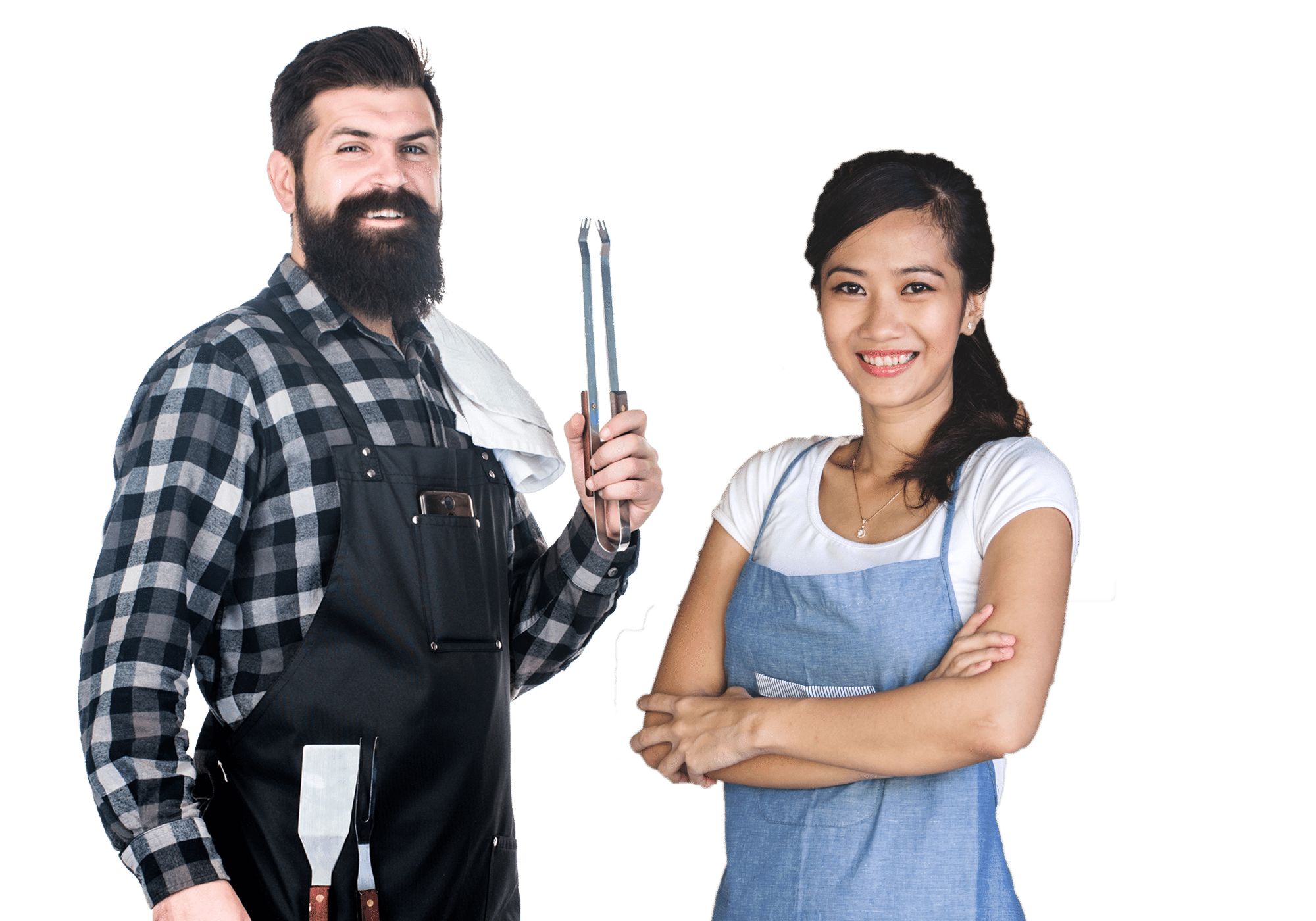 Couple wearing aprons with grilling tools