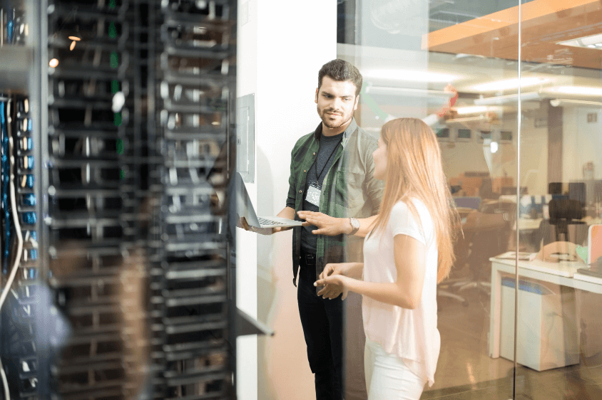 Man and woman in a computer server room