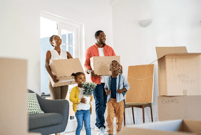 Young, African American family moving into their new home